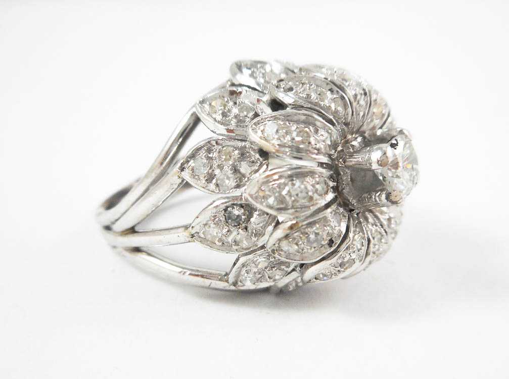 Appraisal: DIAMOND AND NINE KARAT WHITE GOLD DOME RING with round-cut