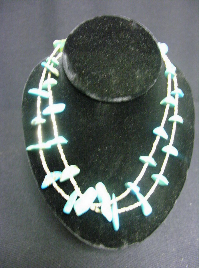 Appraisal: STRANDS TURQUOISE SHELL NECKLACES Turquoise stones spaced with shell beads