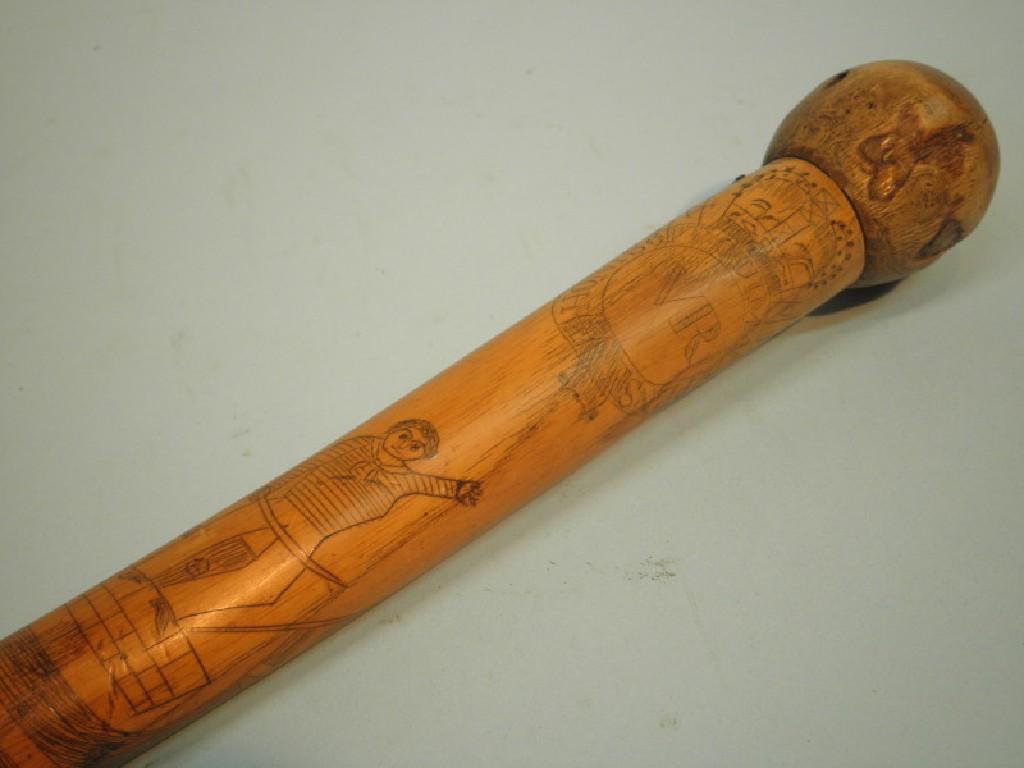 Appraisal: A Victorian walking stick with incised scrimshaw type decoration of