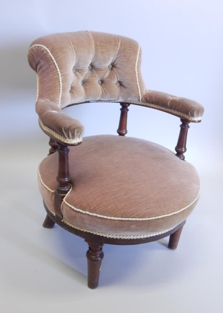 Appraisal: A Victorian mahogany tub shaped chair reupholstered in velvet on