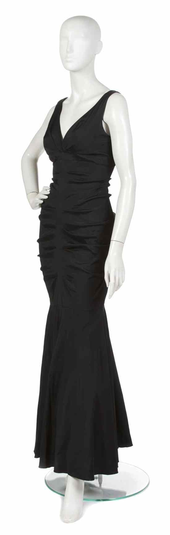 Appraisal: A Christian Dior Black Silk Evening Gown plunging neckline ruched