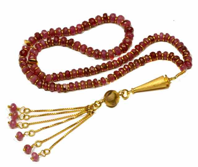 Appraisal: A RUBY AND BEAD NECKLACE with gold spacers in between