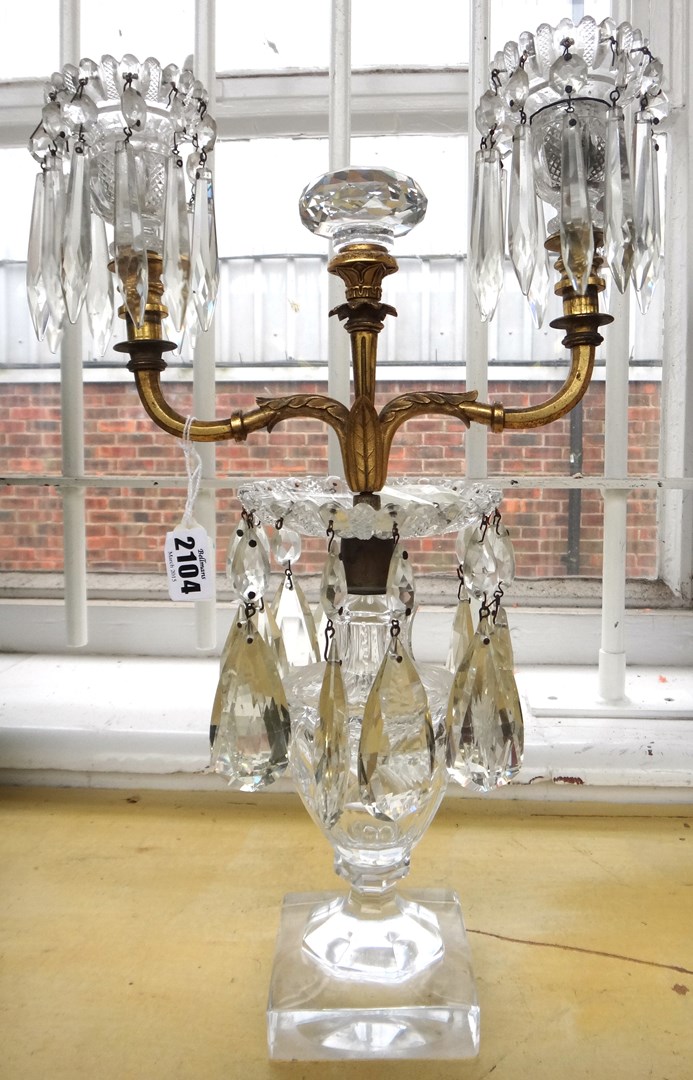 Appraisal: A Victorian gilt metal mounted cut glass two branch candelabra