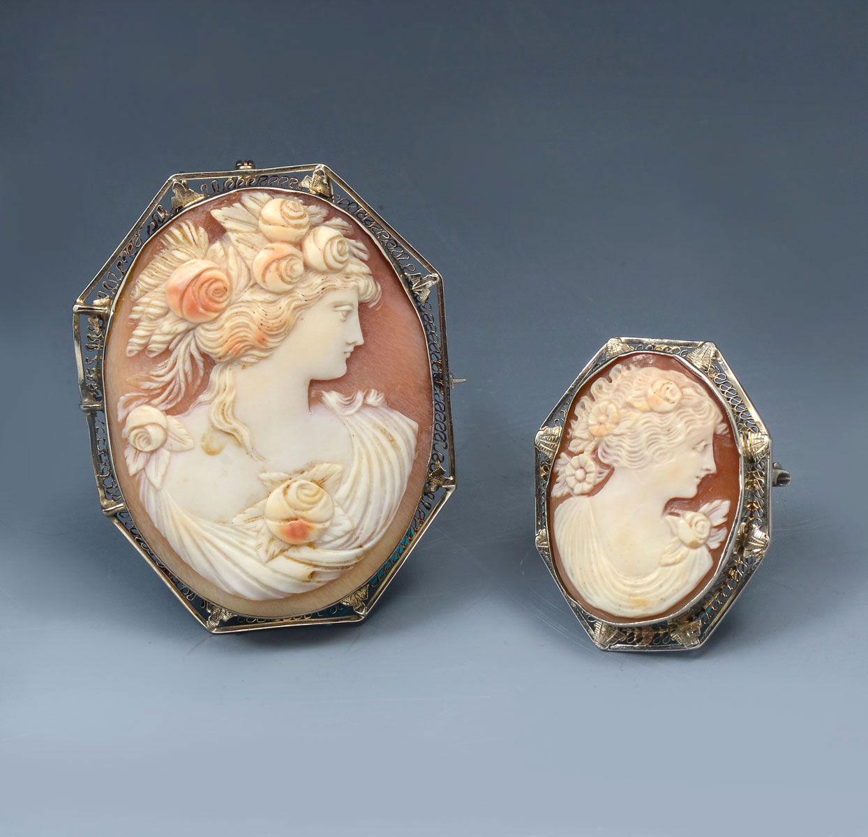 Appraisal: EXTRAORDINARY VINTAGE SHELL CARVED CAMEOS IN K FILIGREE FRAMES Beautiful