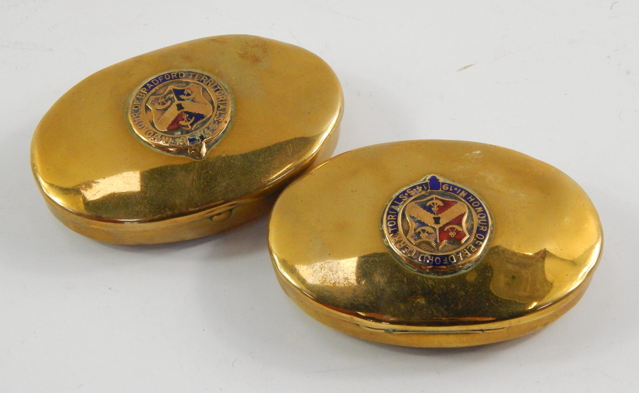 Appraisal: A pair of Great War oval brass tobacco boxes embossed