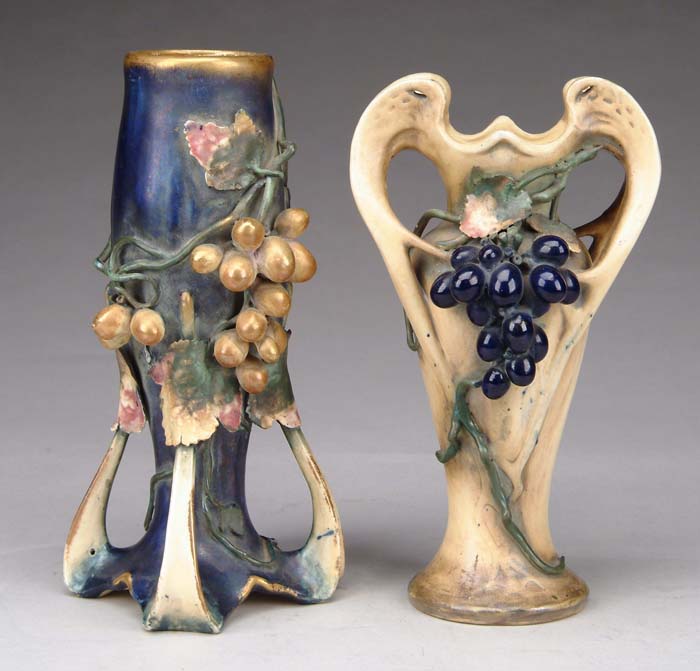 Appraisal: TWO GRAPE DECORATED AMPHORA VASE The tapered pottery vase has