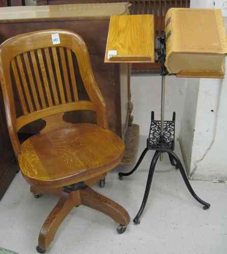 Appraisal: DICTIONARY BOOKSTAND AND OAK DESK CHAIR American c The armless