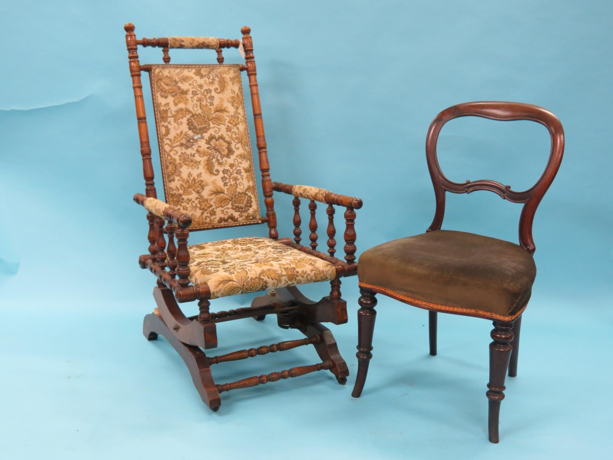 Appraisal: A Victorian turned beech rocking armchair with upholstered seat and