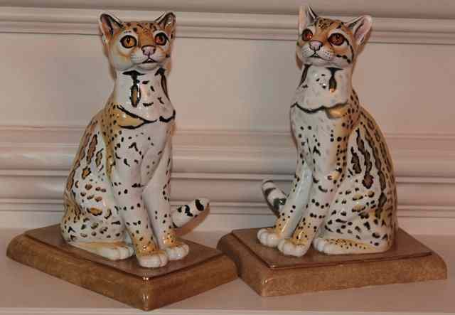 Appraisal: A PAIR OF HALCYON DAYS PORCELAIN FIGURES of ocelot cubs