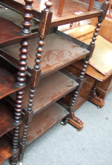 Appraisal: A Victorian mahogany four tier whatnot the three-quarter galleried top