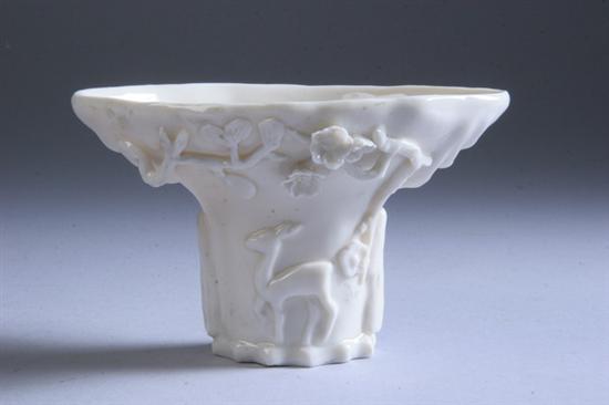 Appraisal: CHINESE BLANC-DE-CHINE PORCELAIN LIBATION CUP Kangxi period Deer under a