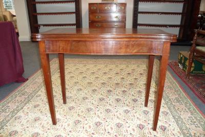 Appraisal: A George III style mahogany card table of serpentine form