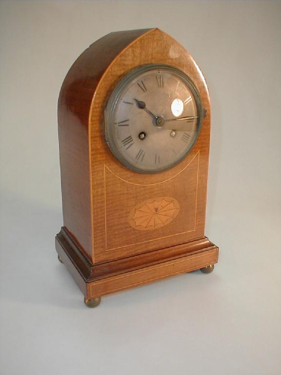 Appraisal: An early thC mahogany lancet shape mantel clock the brass