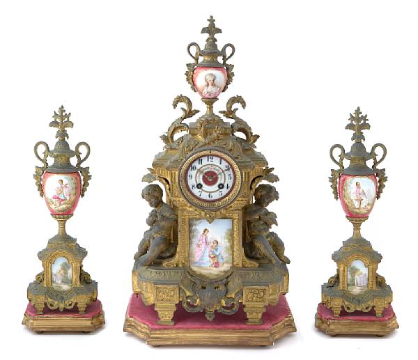 Appraisal: A Continental Sevres style porcelain mounted gilt metal clock garniture