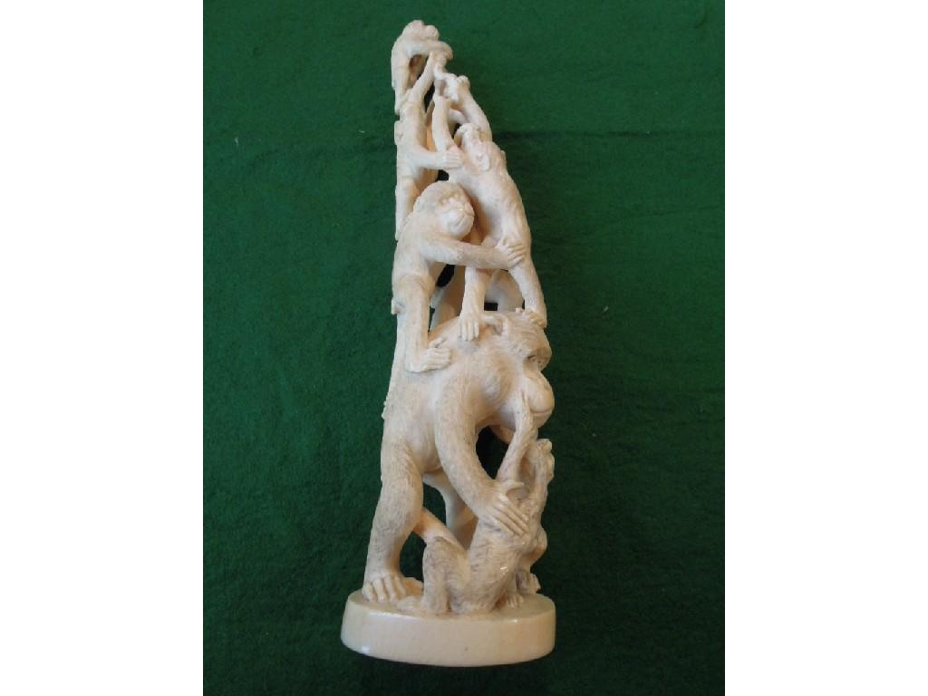 Appraisal: A carved ivory tusk in the form of an acrobatic