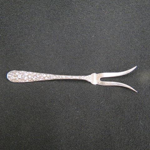 Appraisal: Sterling Silver Lemon Fork repousse floral