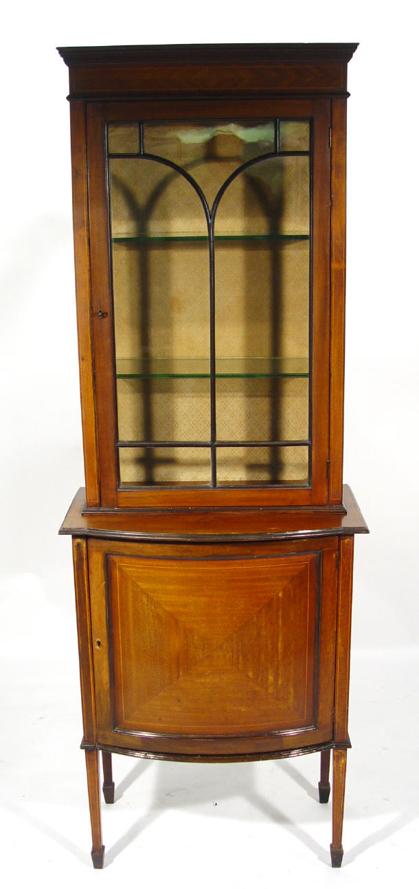 Appraisal: Edwardian inlaid mahogany china cabinet the arch glazed door enclosing