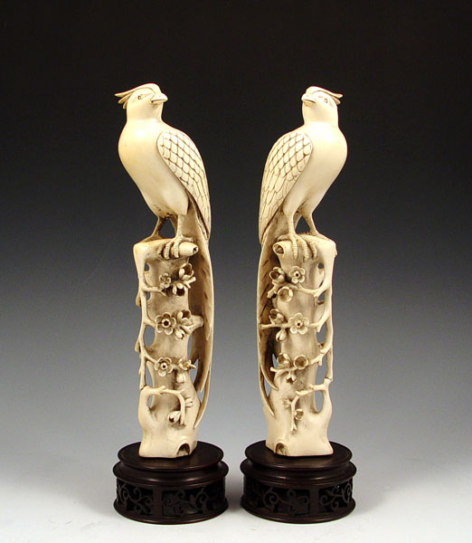 Appraisal: PAIR OF CHINESE FINELY CARVED IVORY PHOENIX BIRDS Proudly standing