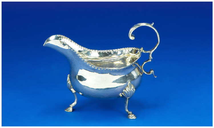 Appraisal: George III Silver Cream Jug Helmet Shaped with Knuckles and