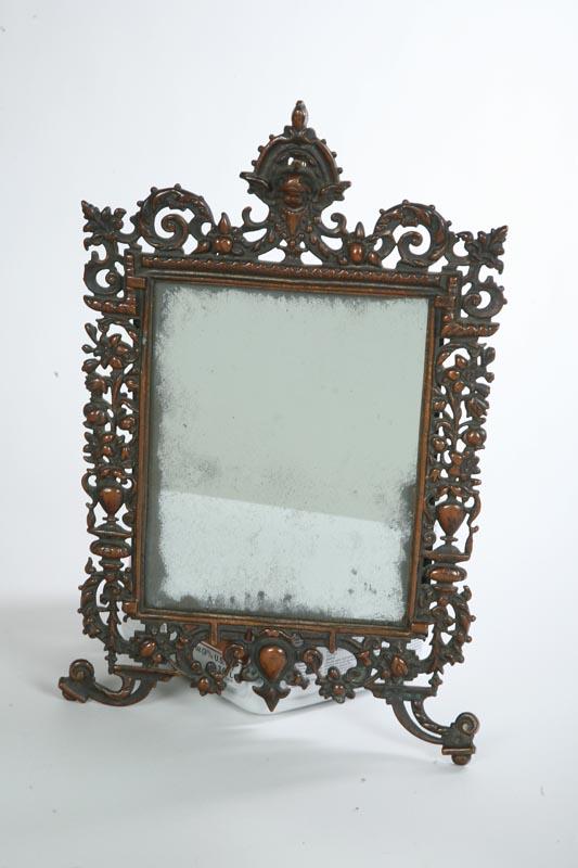 Appraisal: DRESSER MIRROR Pierced cast iron with a cherub urns and