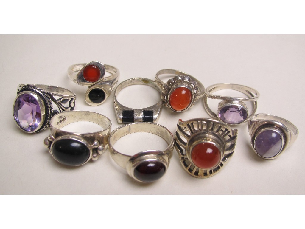 Appraisal: Nine silver dress rings set with onyx amethyst and cornelian