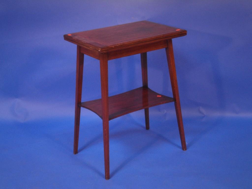 Appraisal: An early thC fold over card table the oblong top