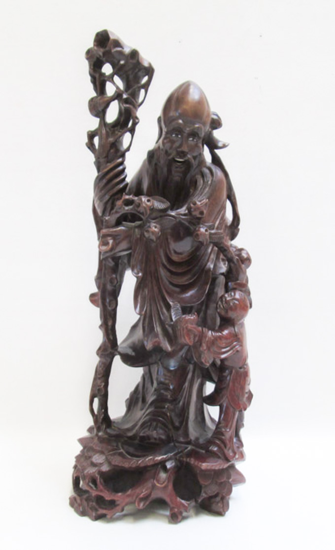 Appraisal: CHINESE CARVED WOOD IMMORTAL FIGURE Shou the god of longevity