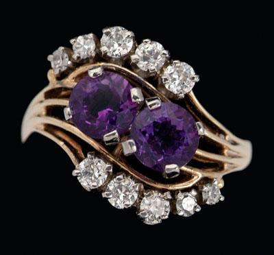 Appraisal: Amethyst diamond ring center set with two round faceted amethysts