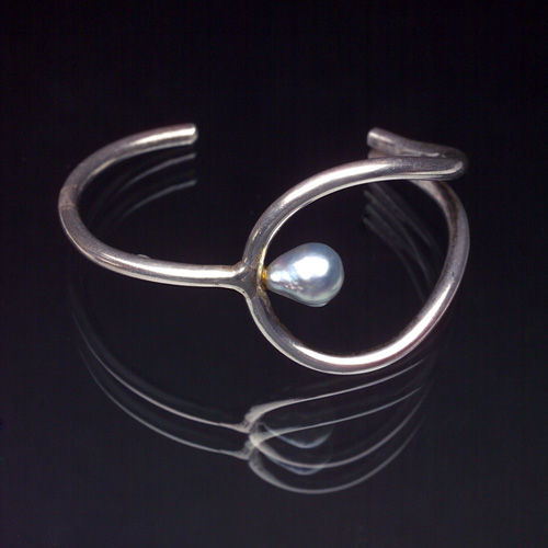 Appraisal: HENRY STEIG Sterling and pearl cuff cut out to fit