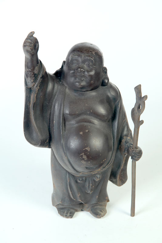 Appraisal: CAST IRON BUDDHA Asian th century Standing Buddha holding a