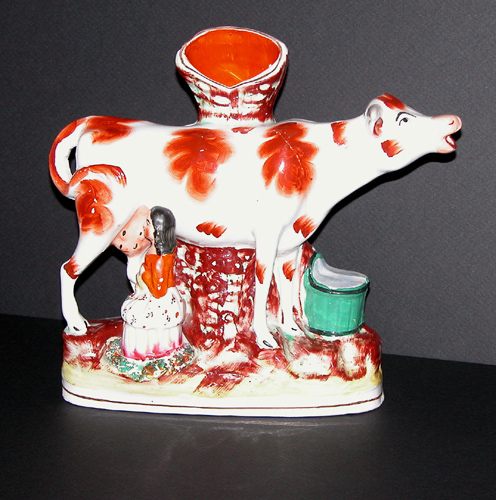 Appraisal: Staffordshire Polychrome Decorated Spill Vase Depicting a Cow and Milkmaid