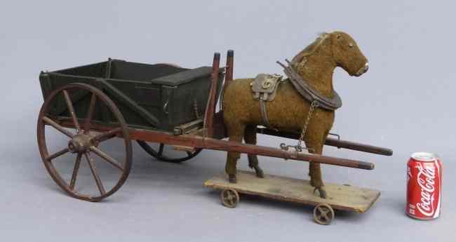 Appraisal: th c platform horse with wagon Has brass label ''G