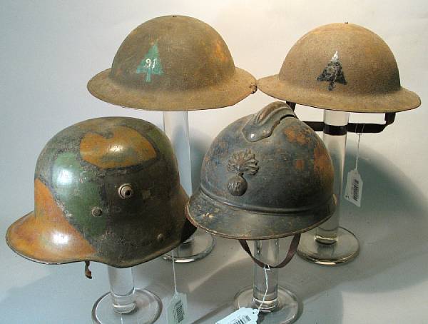 Appraisal: A lot of four World War I helmets Comprising U