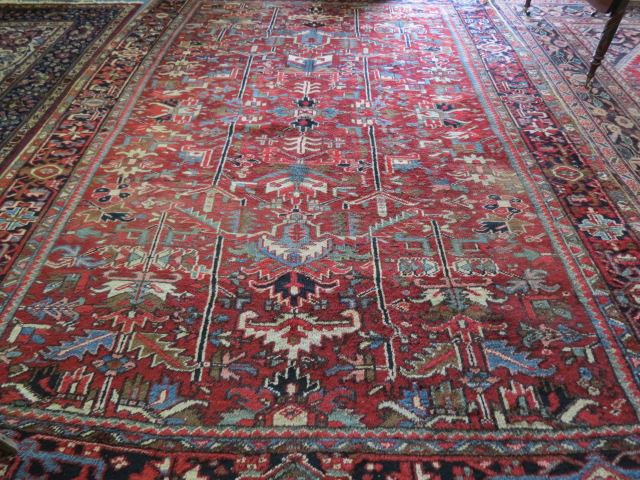 Appraisal: Heriz Persian Handmade Room Size Rug geometric designs red field