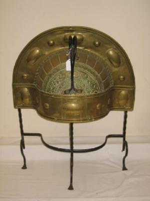 Appraisal: A BRASS AND WROUGHT IRON FIRE GUARD of arched domed