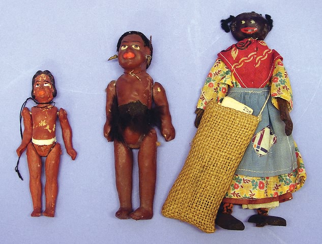 Appraisal: Group of black dolls and papier mache island dolls with