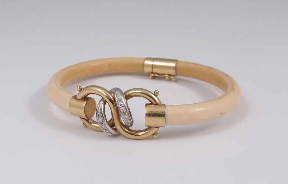 Appraisal: IVORY K DIAMOND BRACELET Ivory bangle with K gold contains