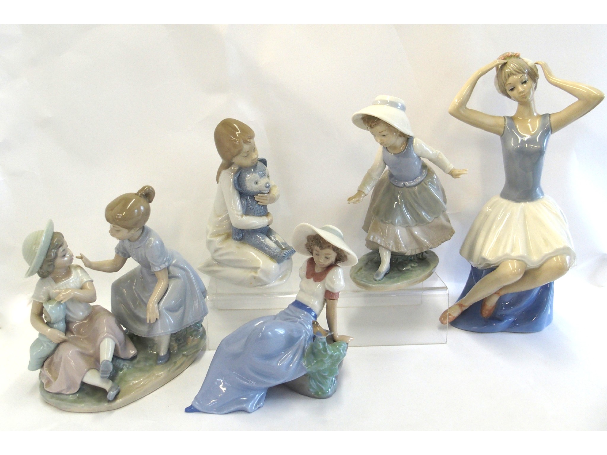 Appraisal: Four Nao figures including girl and teddy girl and bird