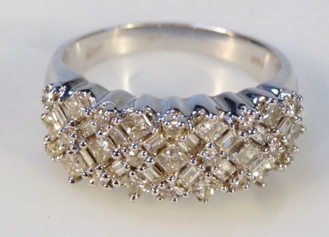 Appraisal: A diamond lattice cluster ring set with thirteen princess cut