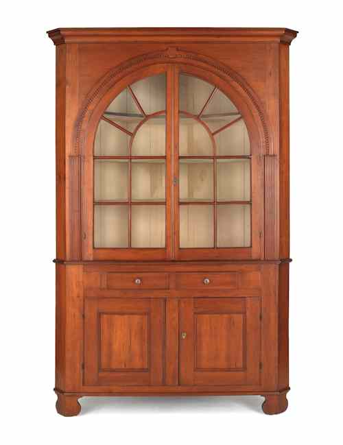 Appraisal: Pennsylvania cherry two-part corner cupboard early th c h w