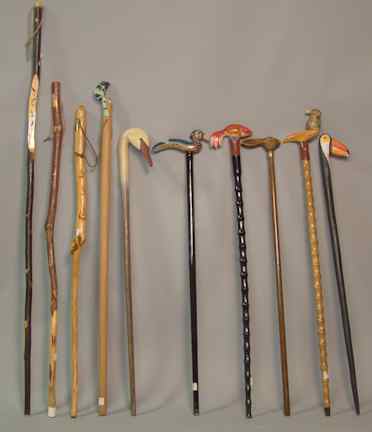 Appraisal: TEN ASSORTED WALKING STICKS some topped with whimsical animal heads