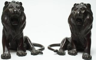 Appraisal: Pair of Japanese Bronze Lion Bookends With glass eyes bearing