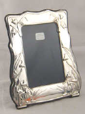 Appraisal: A silver faced photo frame x cm high