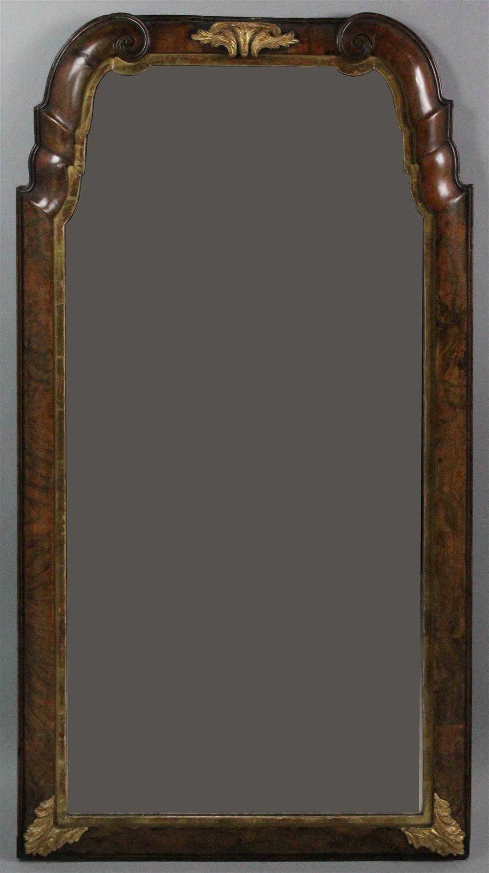 Appraisal: GEORGE I CARVED WALNUT AND PARCEL GILT MIRROR early th