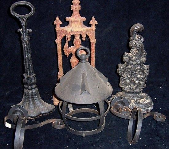 Appraisal: Three cast door stops a lantern holder and two coach