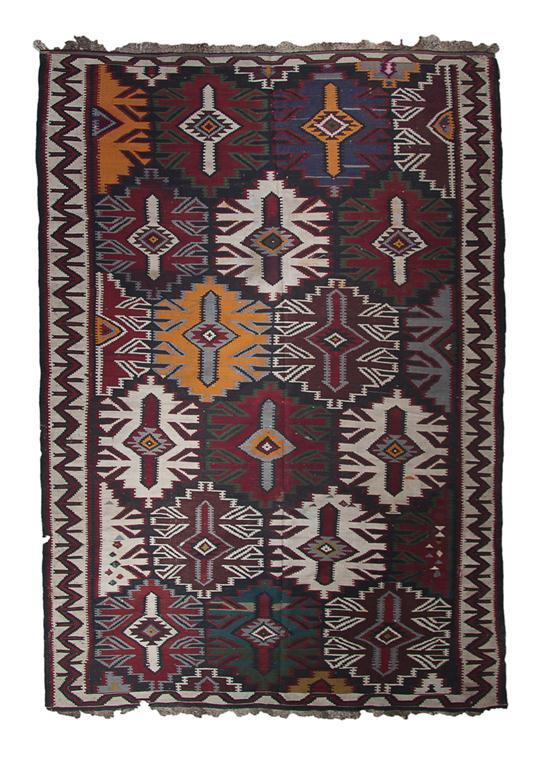 Appraisal: Caucasian Kilim Rug having repeating geometric pattern within a geometric