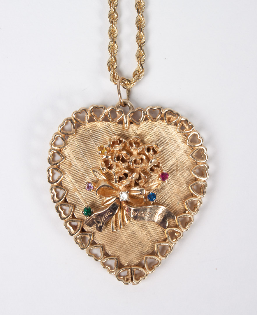 Appraisal: Lady's K gold colored stones heart pendant about in L