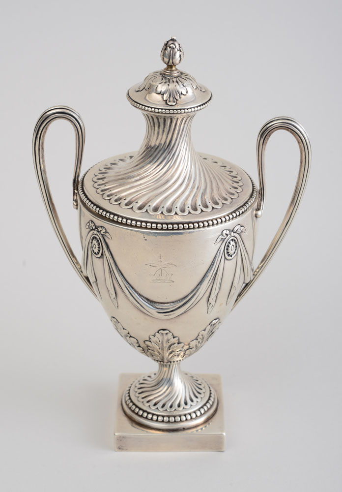 Appraisal: GEORGE III CRESTED SILVER TWO-HANDLED CUP AND COVER Louisa Courtauld