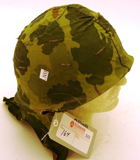 Appraisal: US M combat helmet complete with woodland pattern cloth camouflage