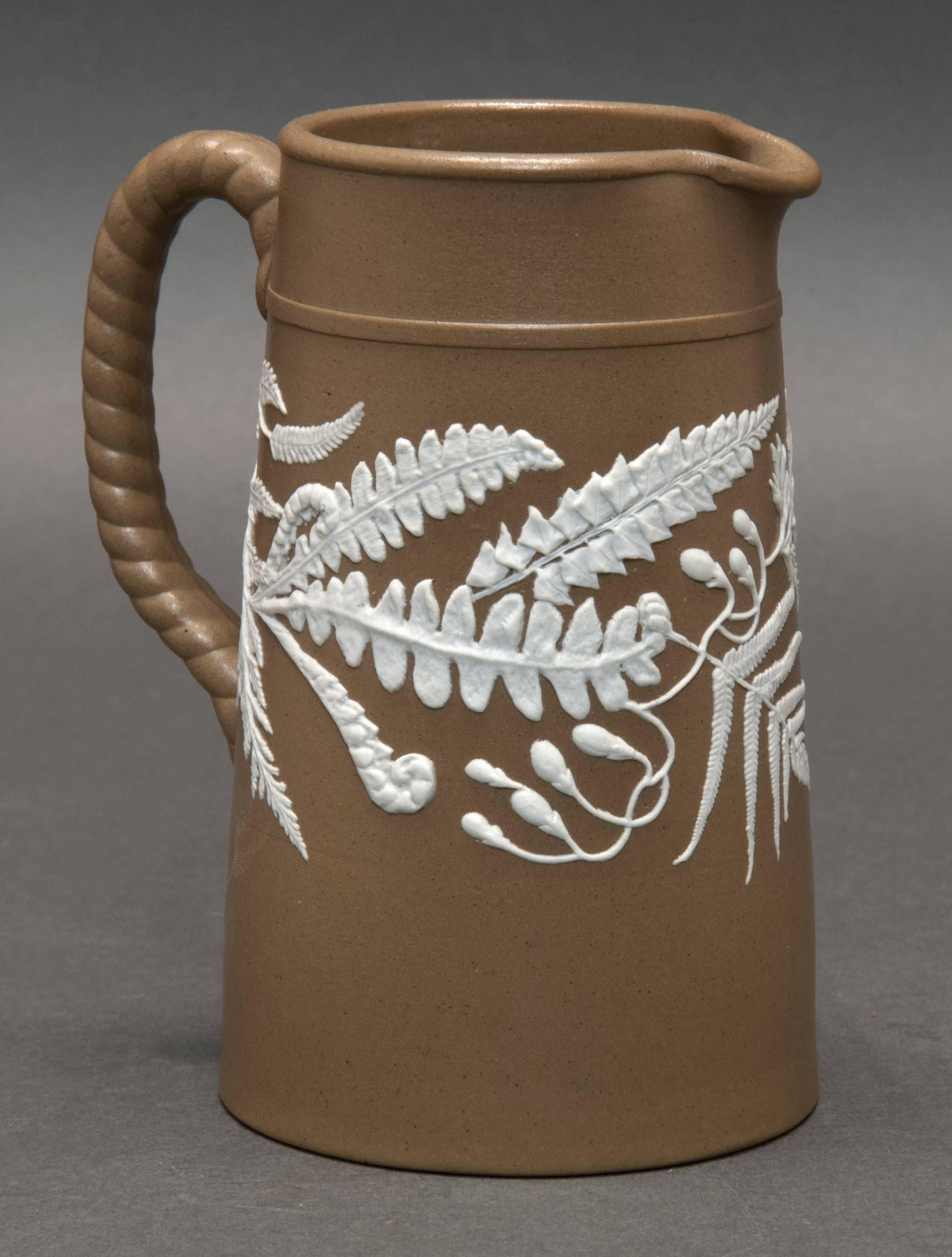 Appraisal: JASPERWARE CREAMER English th CenturyWith white fern design on a